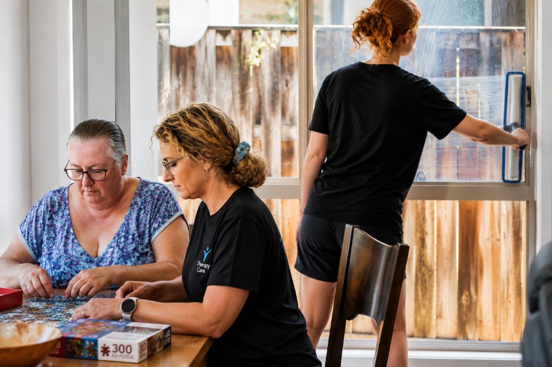 Therapy Care workers supporting a participant at home